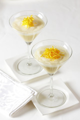 Lemon and orange dessert in high glasses.