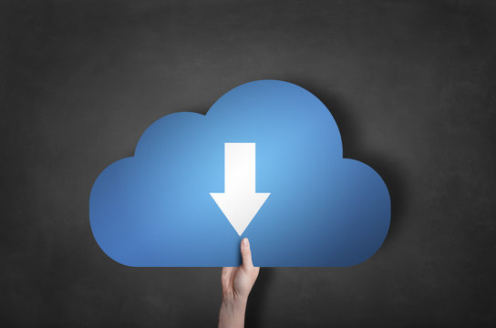 Businessman is holding a blue download cloud icon on black black