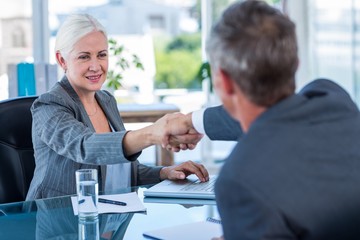 Fototapeta premium Happy business people shaking hands 