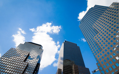 Fototapeta na wymiar Dark skyscraper. A low angle view of contemporary skyscrapers in lower Manhattan, New York City.
