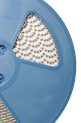 Automatic PCB assembling component reel close up isolated on the white background