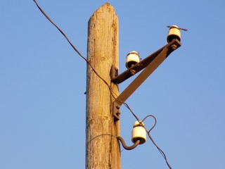 Power line column and blue sky