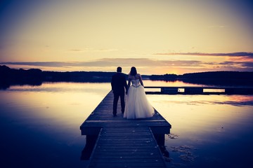 Vintage photo of wedding couple silhouettes in outdoor