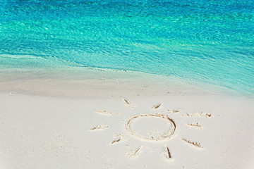 Image of a sun in the sand on the tropical beach