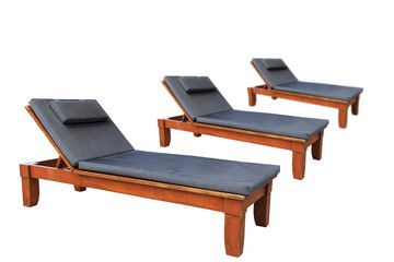 Wooden sunbed with pillows isolated on white