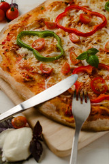 Delicious, freshly baked, homemade pizza with peppers, onions an