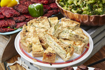Quiche on display at a farmers market