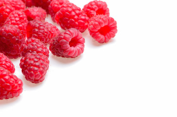 a scattering of raspberries on a white background