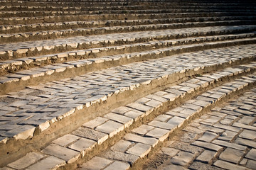 Curved stairs. Full-frame detail of some curved steps, a restored old Roman architectural detail which originally formed seating in ancient open air theatre.