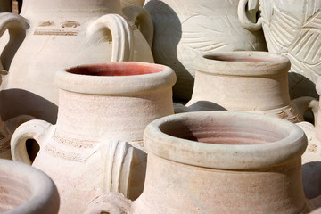 Fototapeta na wymiar Terracotta Urns. Full frame capture of conventional terracotta urns as found in North Africa and the Middle East.