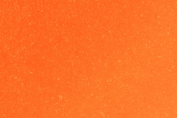 Orange textured sheet of cardboard