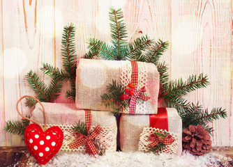 Christmas gift boxes fir branches for new year on wood table