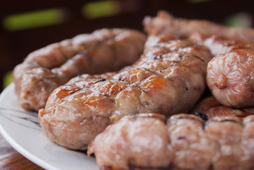 Grilled sausages closeup on a plate
