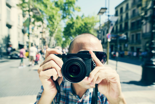 man taking a picture of the observer at La Rambla in Barcelona,