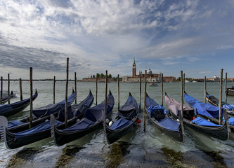 Obraz na płótnie Canvas Gondolas moored in front of island of San Giorgio