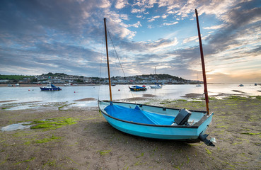 A sailing boat on the beachat Instow, looking out to Appledore across the bay