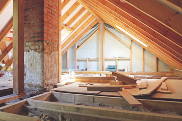 an interior view of a house attic under construction - obrazy, fototapety, plakaty