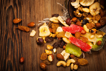 Dried fruits on wooden background