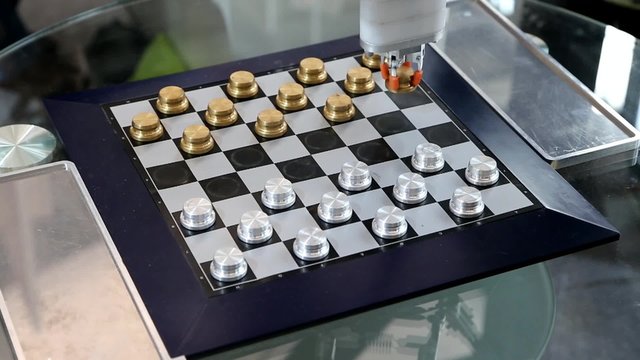 Robot plays checkers with myself at the exhibition