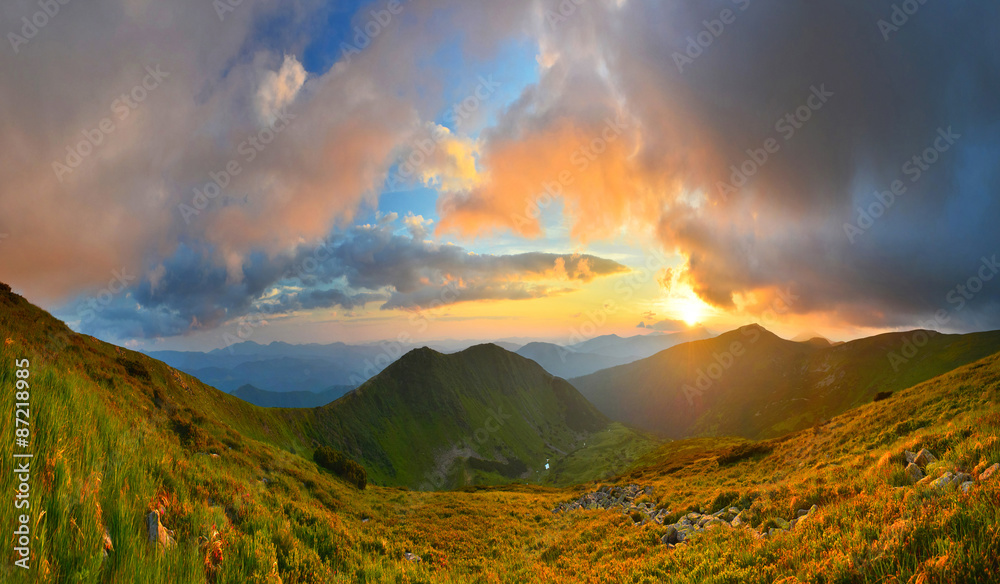 Wall mural sunset in summer mountains