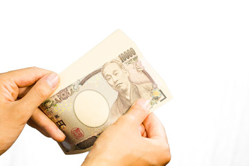 counting Japanese currency with hands