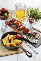 Country dinner - roasted veal chops with vegetables , potatoes 