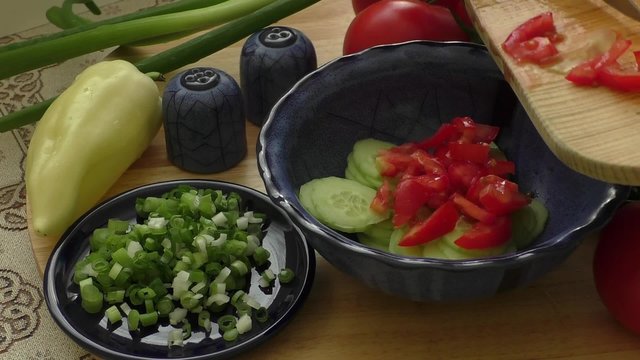 Spring salad with tomato, cucumber and onion 
