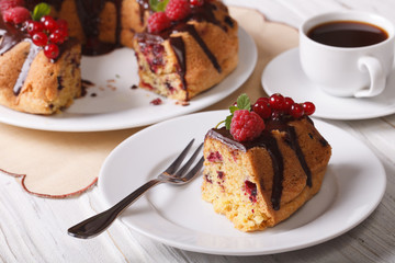 Piece chocolate cake with berries close-up and coffee. horizontal
