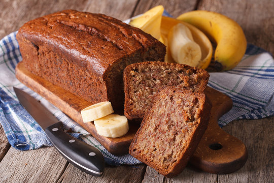 Homemade banana bread sliced on a table close-up. Horizontal
