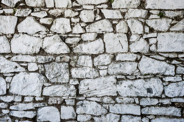 old grungy whitewash traditional stone wall in Ireland