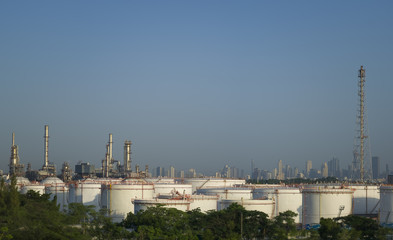 row of large white tanks for petrol and oil in Thailand