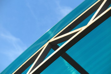 Arc polycarbonate canopy against a blue sky