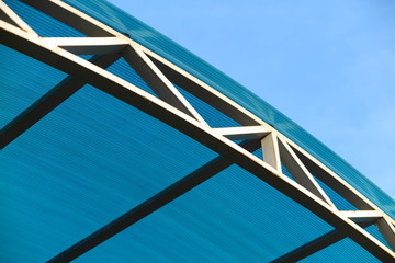Arc polycarbonate canopy against a blue sky
