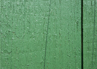 Old wood texture with a shabby green paint front