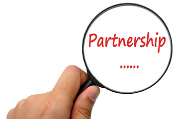 Partnership word. Magnifier and puzzles.