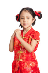Asian girl in chinese cheongsam dress with gesture of congratula
