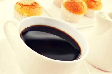 coffee and magdalenas, typical spanish plain muffins, filtered