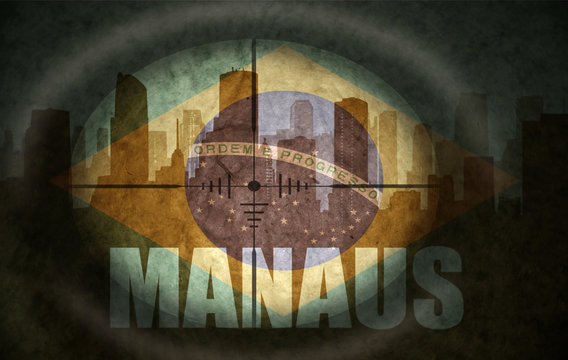 sniper scope aimed at the abstract silhouette of the city with text Manaus at the vintage brazilian flag