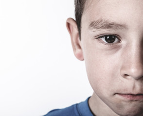 Fototapeta premium Photo of adorable young happy boy looking at camera.