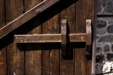 Old wooden door with wooden latch