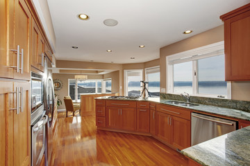 wonderful kitchen with deep hardwood floor and marble counters.