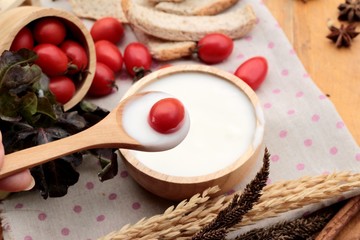 White yogurt and fresh cherry tomatoes