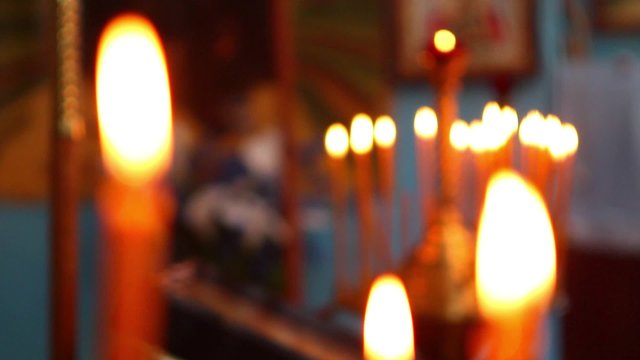 Candles are lit in the temple. Candles illuminate the church. Magic.