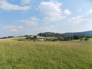 Meadow, forests and sky