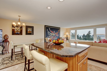 traditional kitchen with island and tile floor.