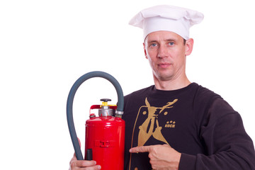 Sicherheit in der Küche, Koch präsentiert den Feuerlöscher
