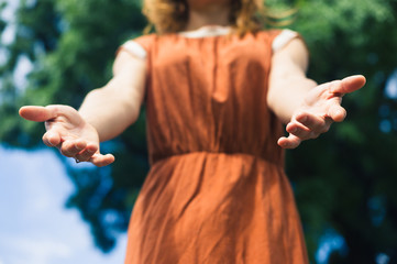 Young woman offering helping hands