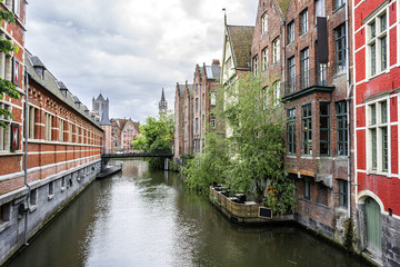 Naklejka premium View of picturesque houses along channel in Ghent. Belgium.