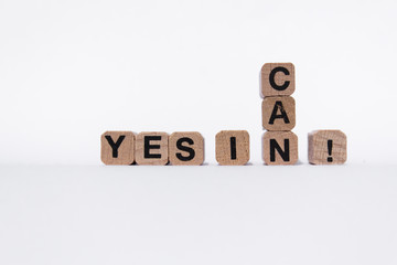 yes i can  - motivation text on wooden cubes, isolated on white background