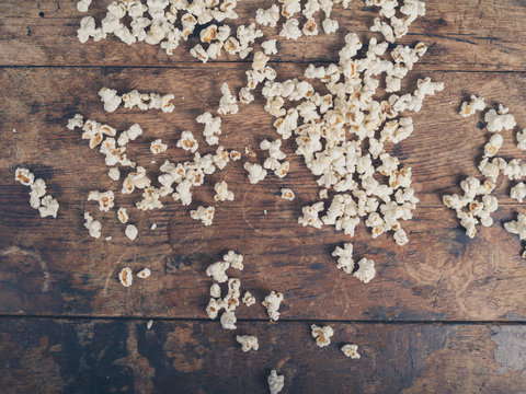 Popcorn on wooden surface